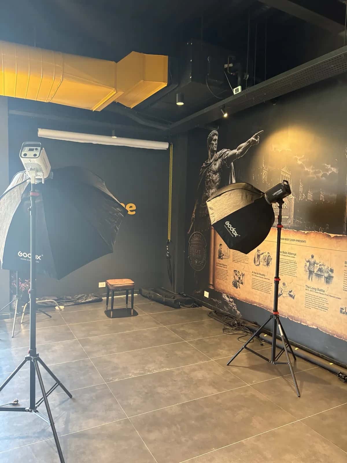 Softbox and umbrella lighting set up for a portrait shoot on the Rootmedia studio floor